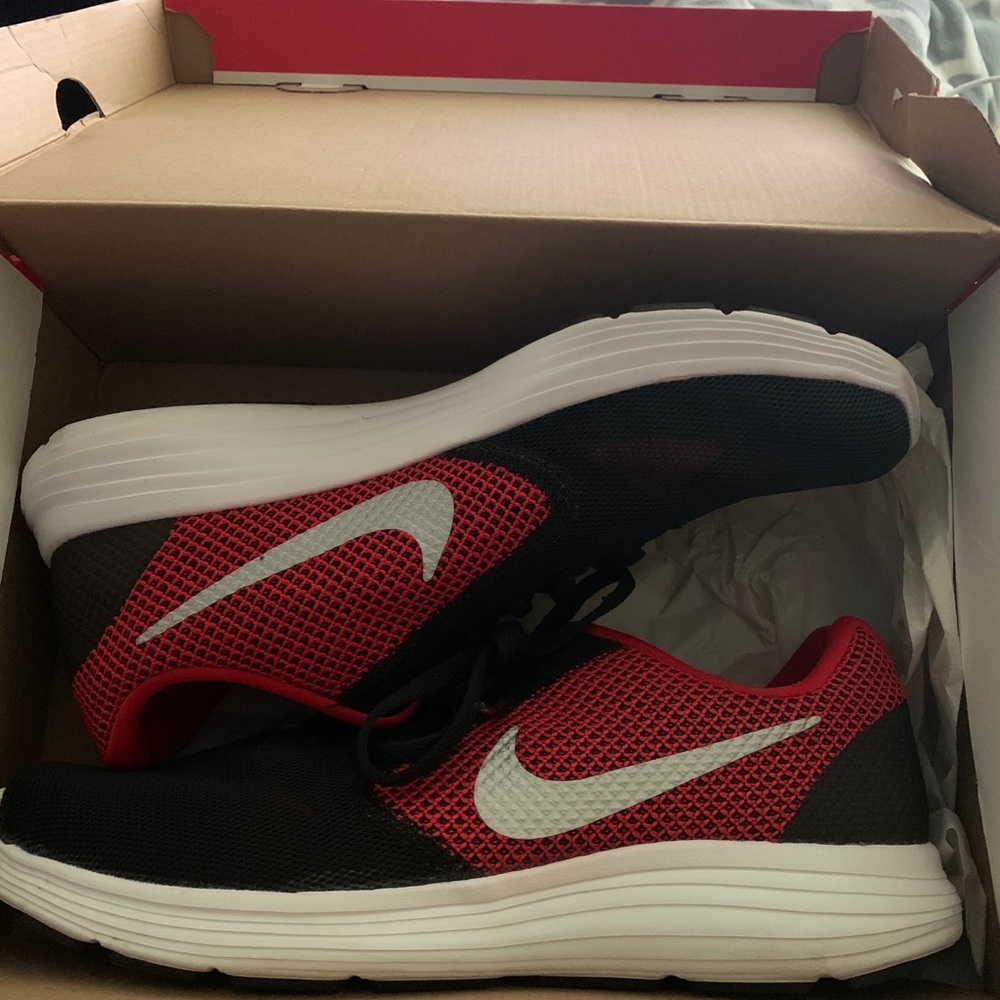 Red black and white Nike shoes